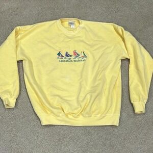 Yellow crewneck sweatshirt with embroidered‎ sailboats and "Saginaw Michigan"